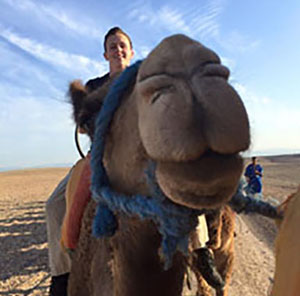 Student Riding Camel